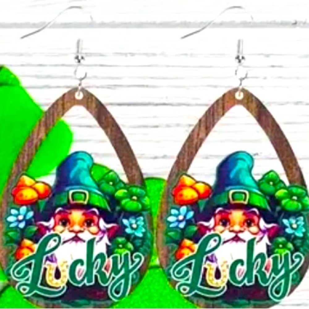 These earrings are adorable gnomes, adorned in a red hat & a mischievous smile.